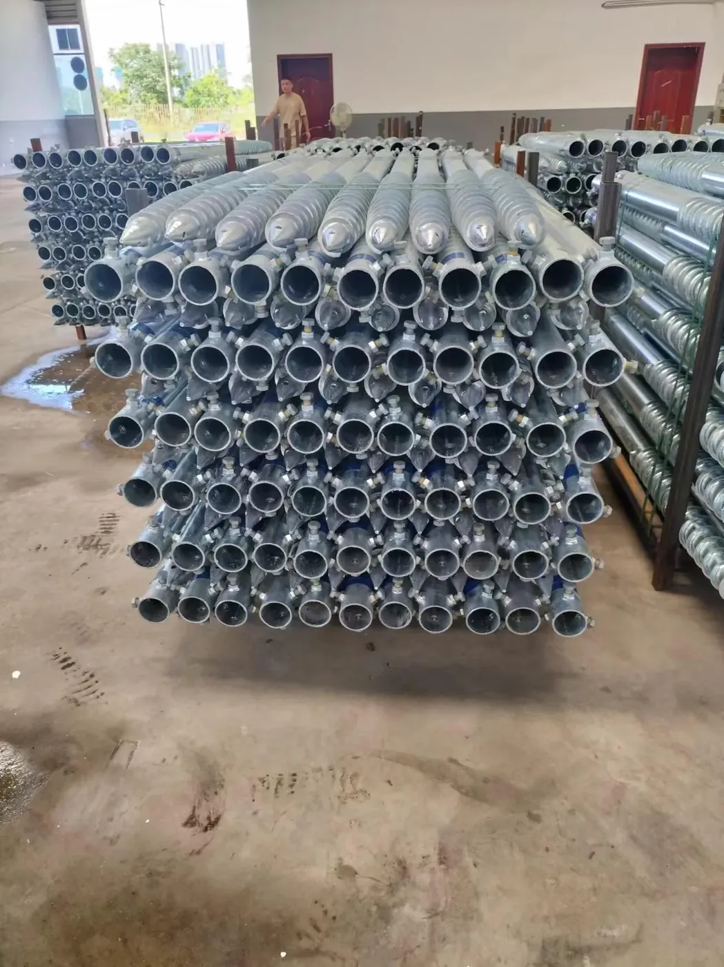 Hot-dip galvanized and packaged ground screws.